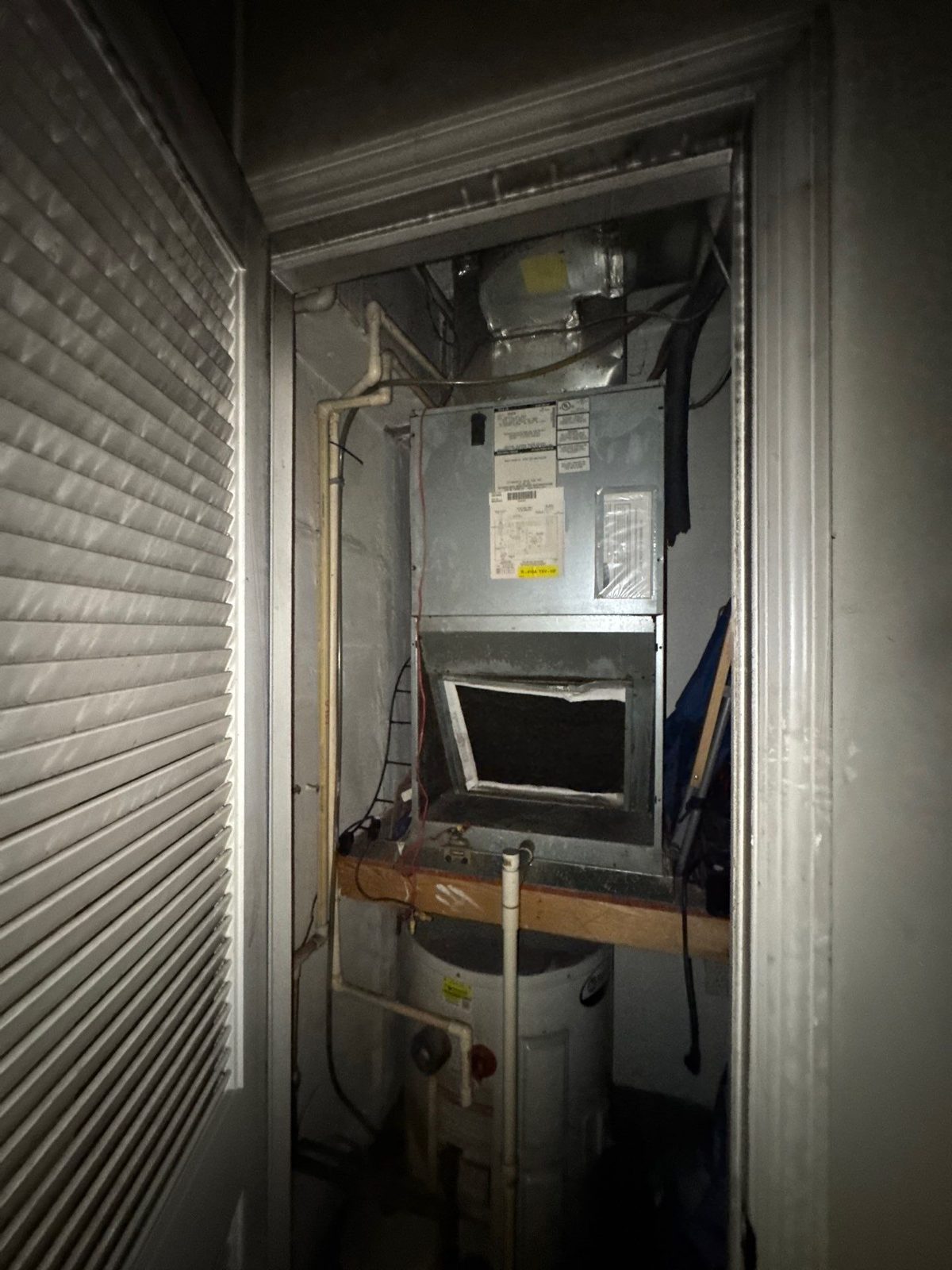 Air handler and water heater in a closet in a fire-damaged apartment in Washington, DC, August 2025