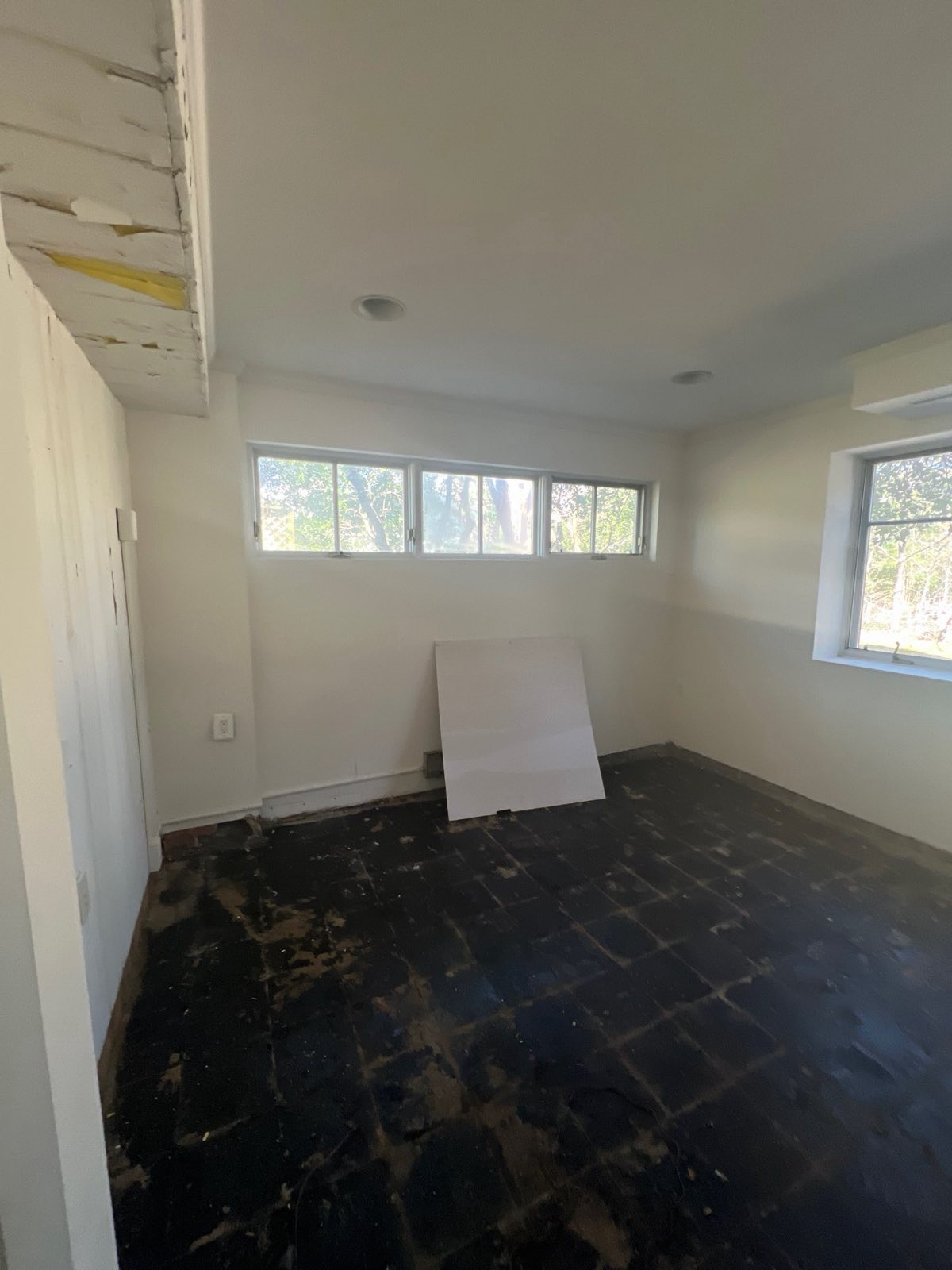 Hardwood floor water damage on a documented Chevy Chase, MD restoration project before drying