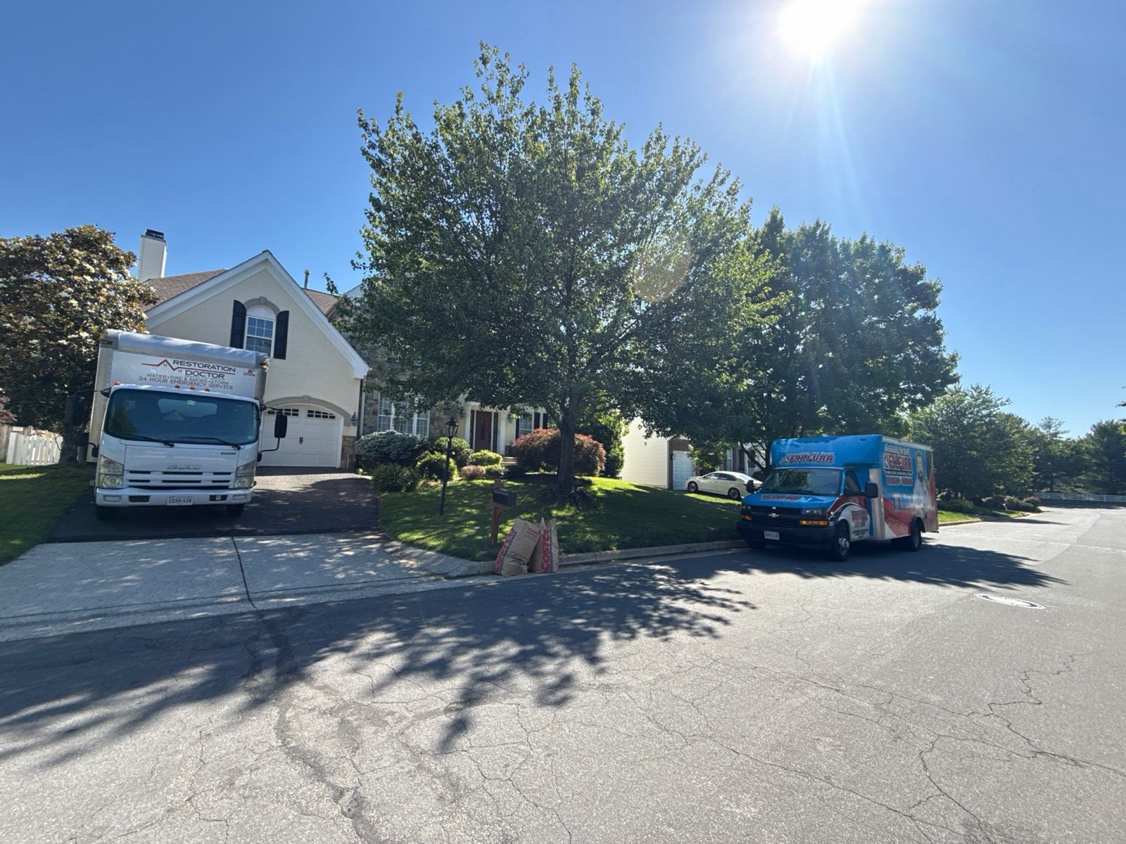 Restoration Doctor response trucks on scene at a residential water damage emergency